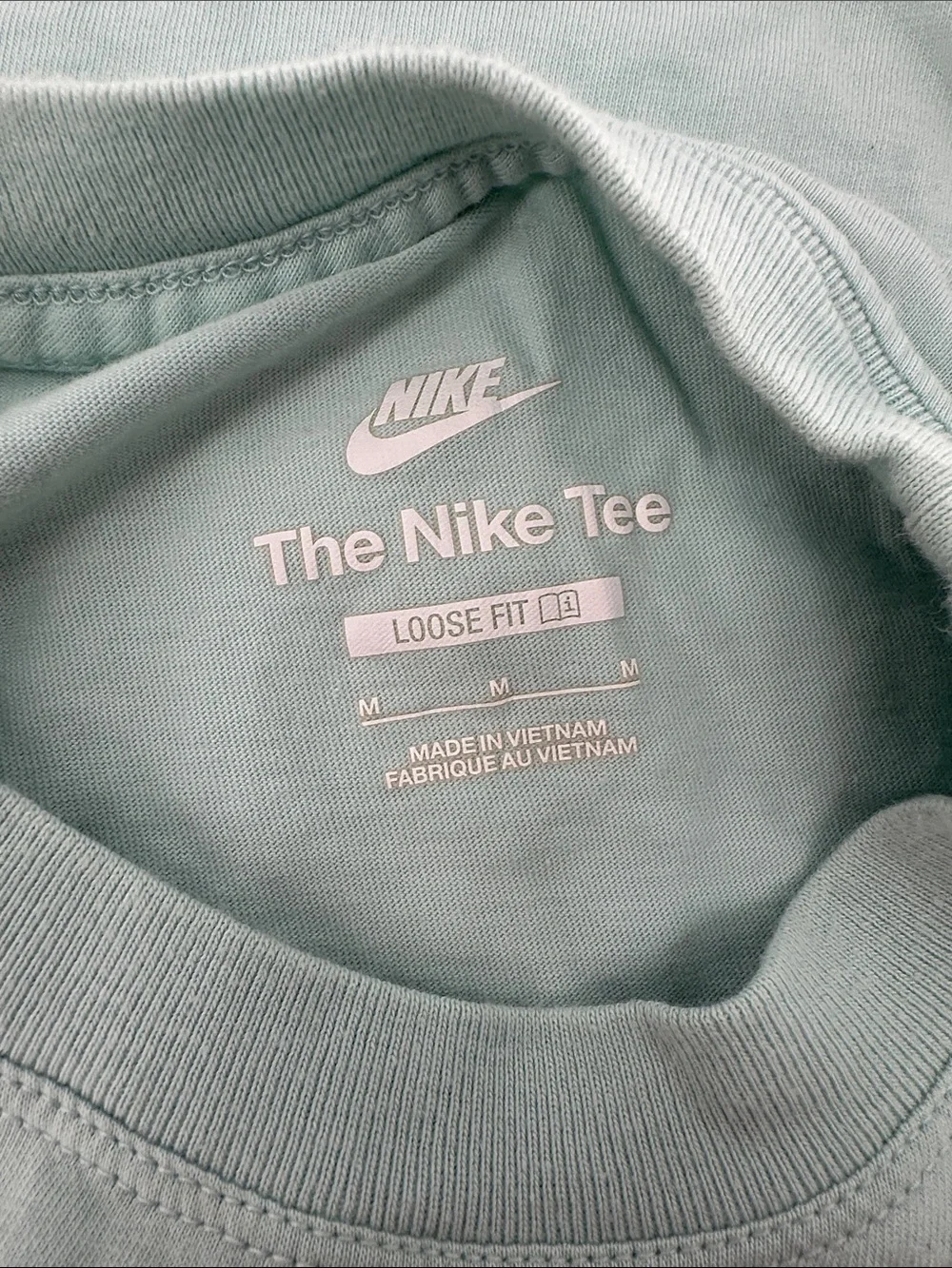 Nike Kids Mint Green Tee with Blue Logo and Floral Accents